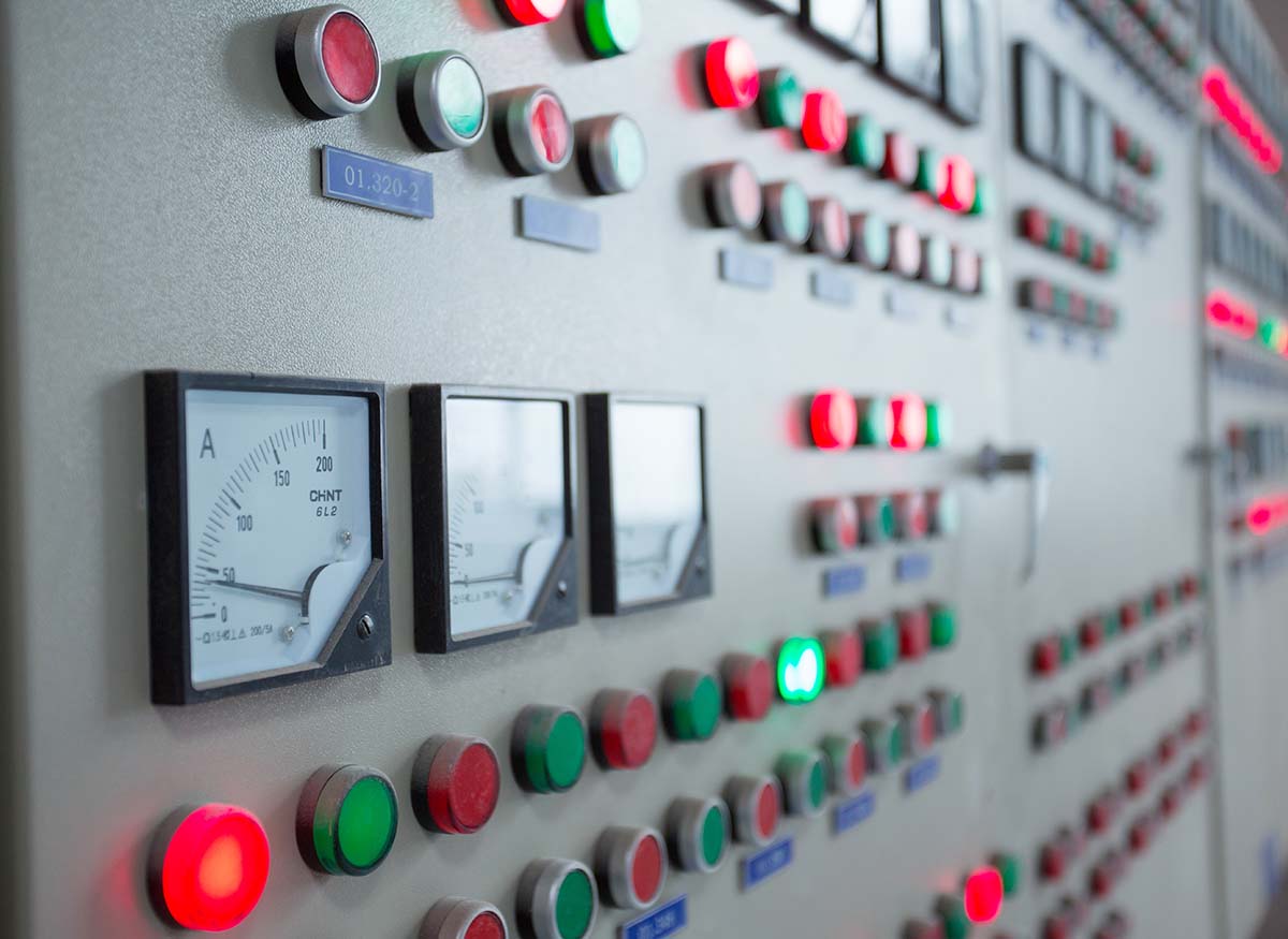 How does a PLC communicate with SCADA